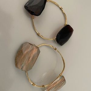 Gold bracelet with two colored stones